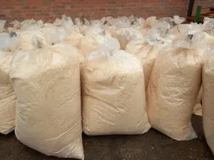 Premium wood sawdust packed in large plastic bags at BBS Sawmill, ideal for poultry bedding, biomass fuel, mushroom cultivation, composting, and industrial use in Nepal.
